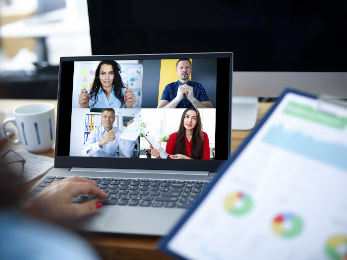 Woman participates in online meeting